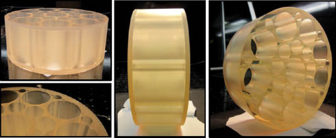 Figure 9 Photographs of a bonded 150 mm diameter lightweight mirror. Two thin slabs of low-expansion material are bonded to a heavily lightweighted middle section and then polished as required. This mirror is uncoated but coatings have been applied to similar mirrors. Pictures courtesy of Gooch and Housego (UK) Ltd.