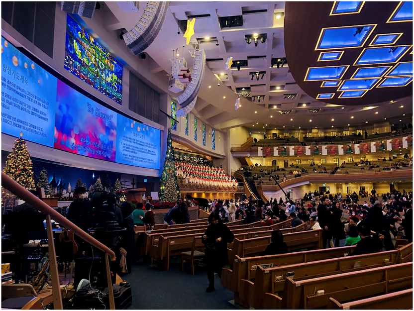 Photo 7: 
Interior view of the main nave of Sarang Church during a sermon, Seoul. © Adrian Gasser, December 2024.
