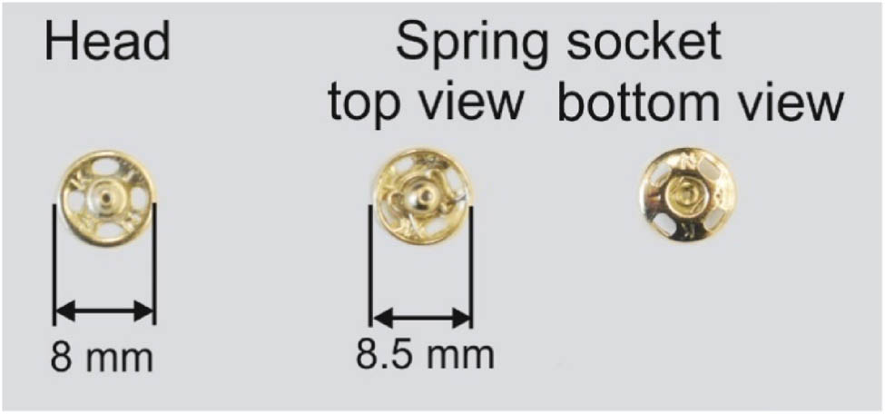 Figure 1
Two parts of a small clothing snap: head and spring socket.