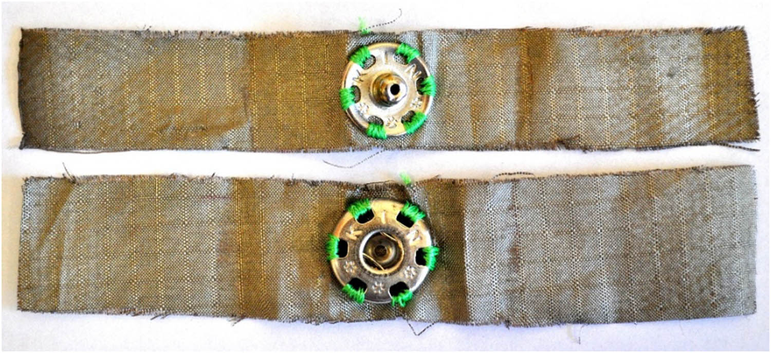 Figure 3
The appearance of the tested Nora Dell fabric sample (with a large snap fastener attached to a non-conductive thread).