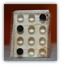 Figure 2 Constructed delta sample phantom. The phantom contains three delta samples filled with undiluted Resovist®. Each sample has a diameter of 2 mm. The distance of the samples is approximately 12 mm.