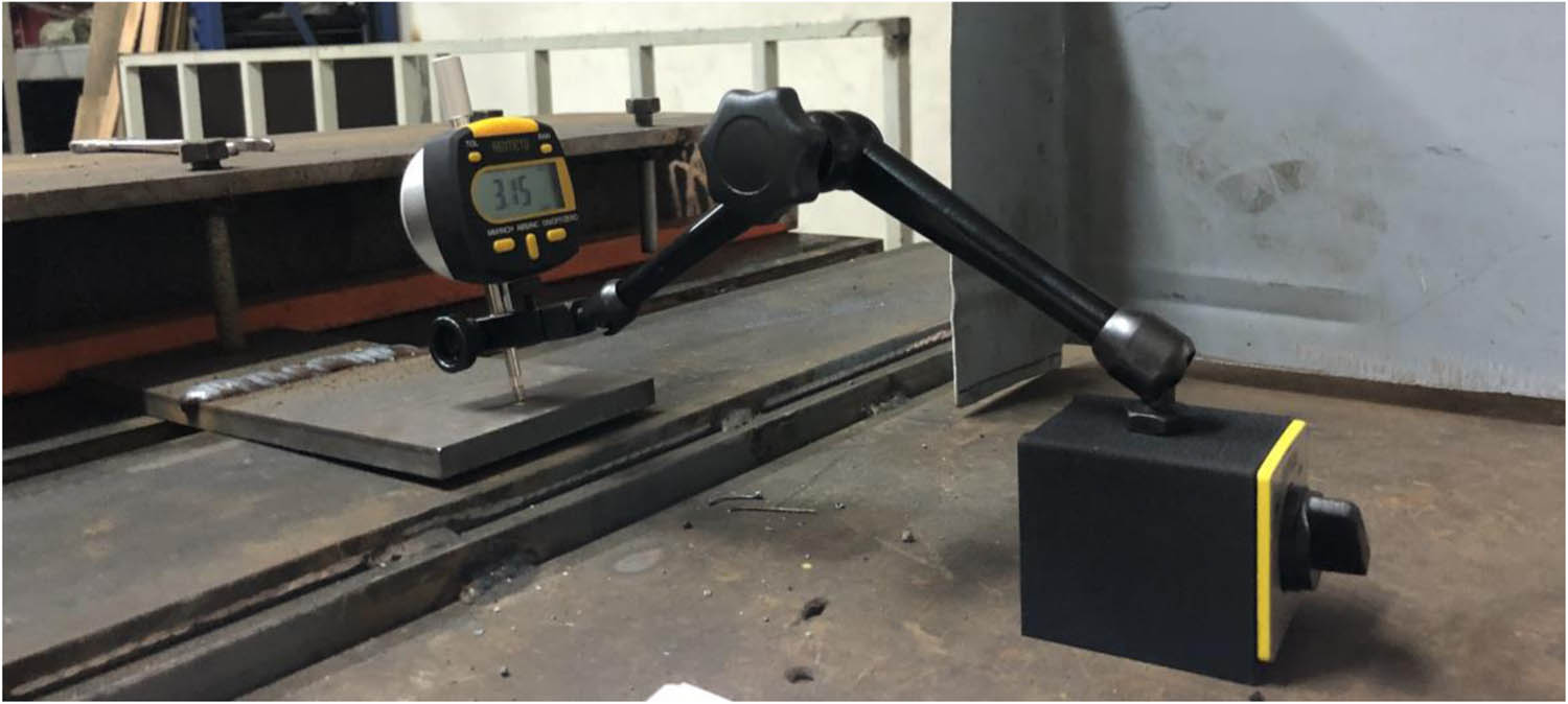 Figure 1
The welded workpiece and the dial indicator.