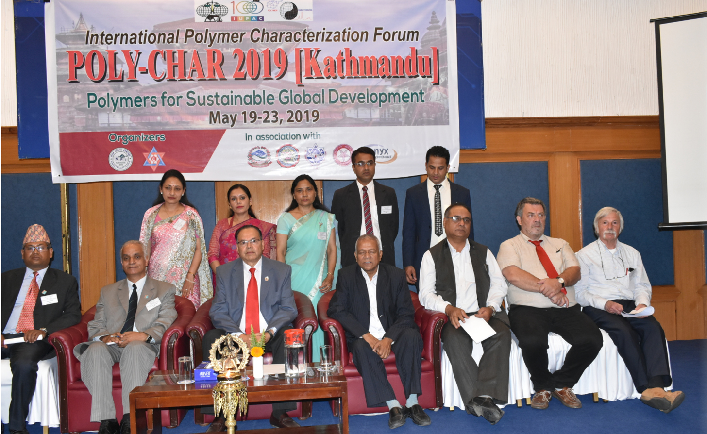 Opening ceremony. Front row: 2nd from left – Prof. Dr. Rameshwar Adhikari (Organizing Chairman of POLY-CHAR 2019); 2nd from right - Prof. Dr. Jean-Marc Saiter (President of POLY-CHAR Scientific Committee); and (far right) Prof. Michael Hess.