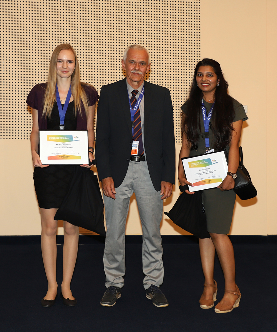  
        Chairman of Slovak National Committee of IUPAC (Milan Drábik) with IUPAC Poster Prize awardees holding the Certificates (left to right: Martina Machalová and Dhiya Krishnan
      