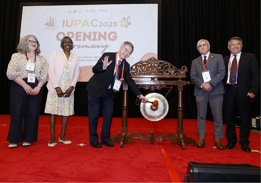 On stage for the opening gong strike (from left): Helen Pain, Dorothy J. Phillips, Soon Ting Kuek, Eihud Keinan, and Zhigang Shuai