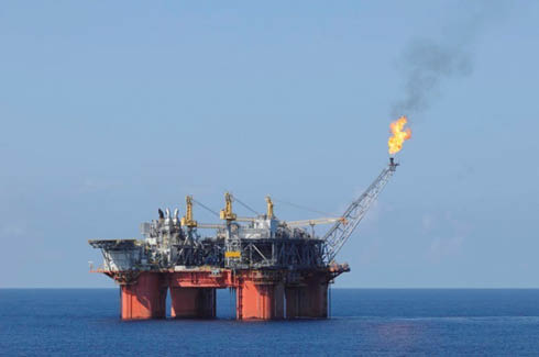 Figure 2: 
						Semi-submersible petroleum platform fitted with a gas flare tower.
					
