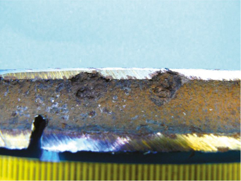 Figure 5: 
						Cross section of a tube damaged by pitting corrosion.
						Reprinted from Julian et al. (2015), with permission from International Geothermal Association.
					