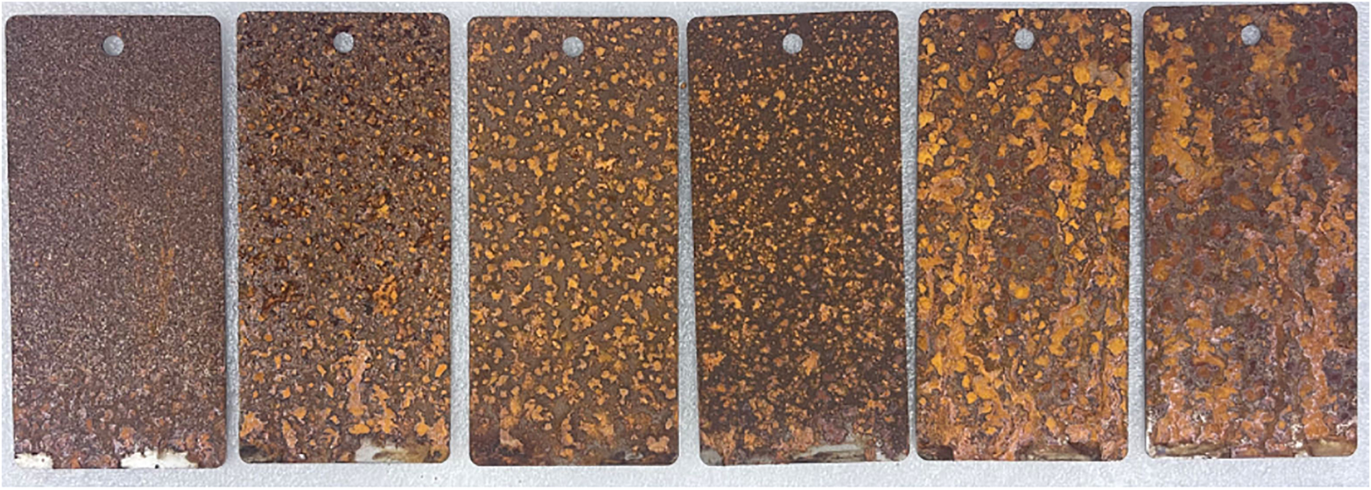 Figure 5:
Morphology of carbon steel corrosion under varying salt spray concentrations (35 °C, 85 %). From left to right: 30 mg/m3; 50 mg/m3; 75 mg/m3; 100 mg/m3; 120 mg/m3; 150 mg/m3.