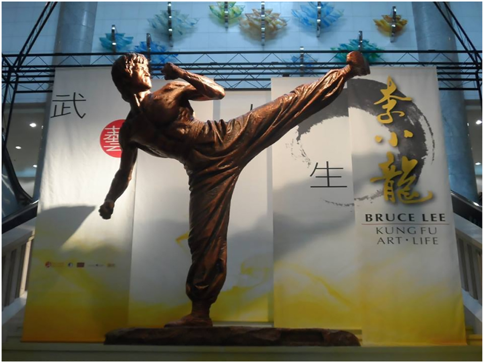 Figure 1: 
					A close-up image of the statue of Bruce Lee at the Hong Kong Heritage Museum (™ & © Bruce Lee Enterprises, LLC. All Rights Reserved. Designed and Produced by Chu Tak Shing).
				