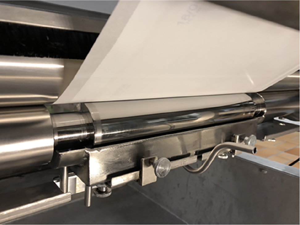 Figure 11: Roller coating of flat sheet membrane for the production of thin film composite membranes.