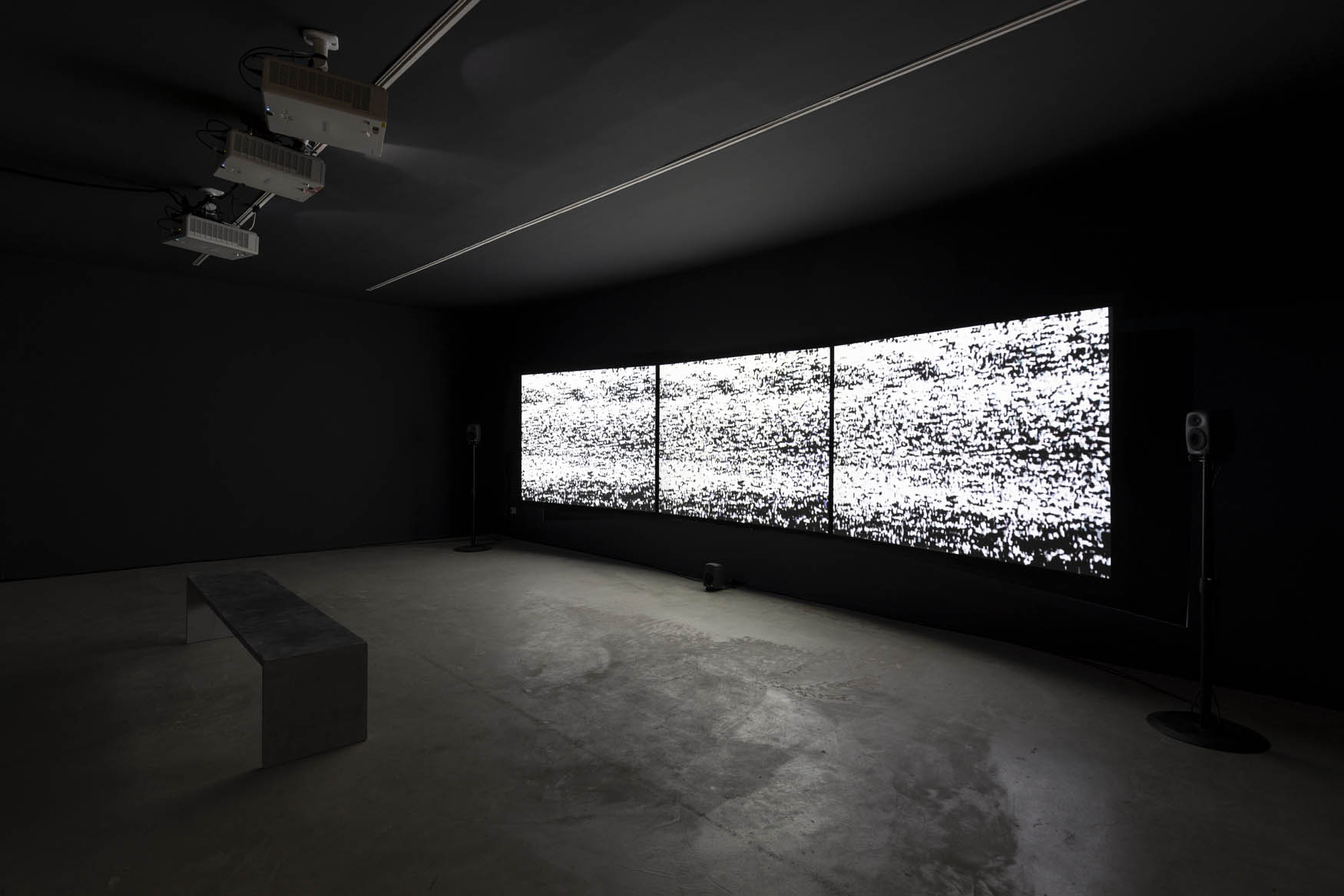 Figure 4 
               “Static on all three screens as shown in an exhibition space in Lisbon, Portugal.” Credits: “James Newitt, HAVEN, exhibition view at Galeria da Boavista, Lisbon, 2023. Photo: Bruno Lopes. Courtesy of the artist and Galerias Municipais de Lisboa/EGEAC.”]
            