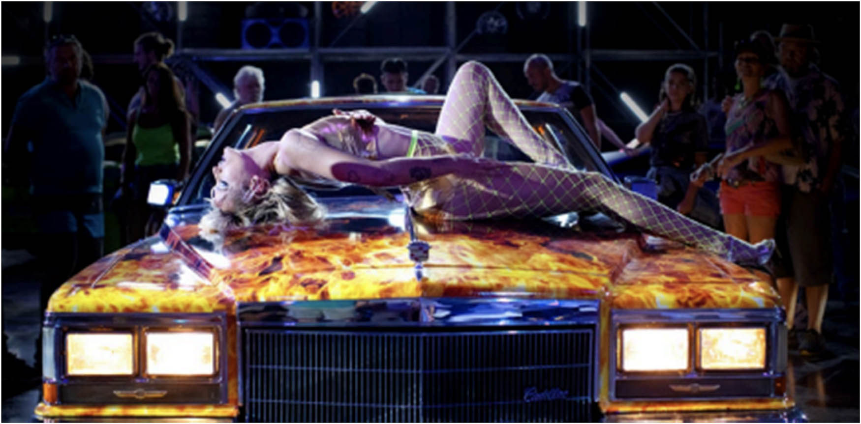 Figure 2 
               Alexia dancing atop the Cadillac (Titane, 2021).