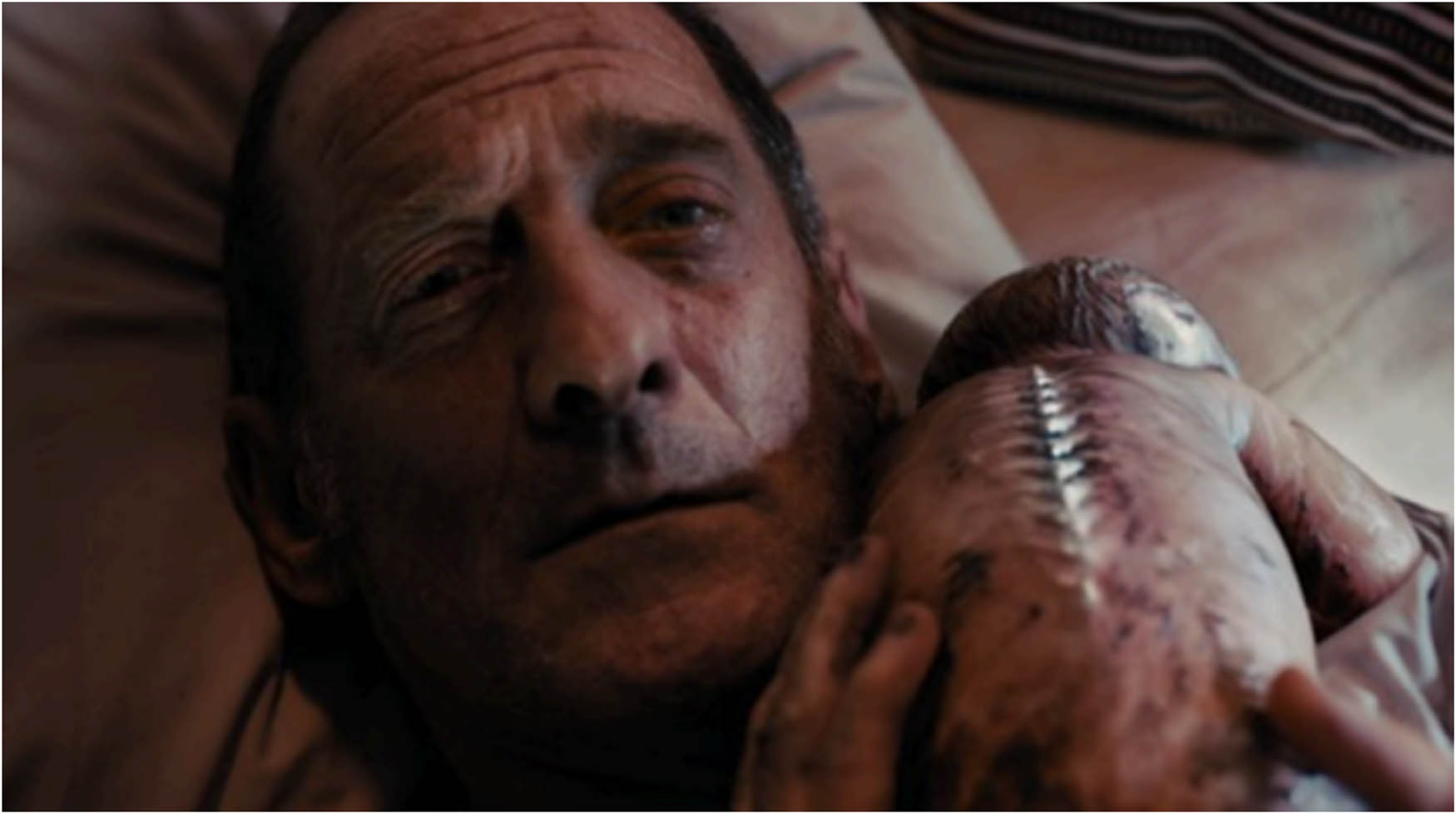 Figure 5 
               Vincent embraces Alexia’s child after her death. Titane (2021).