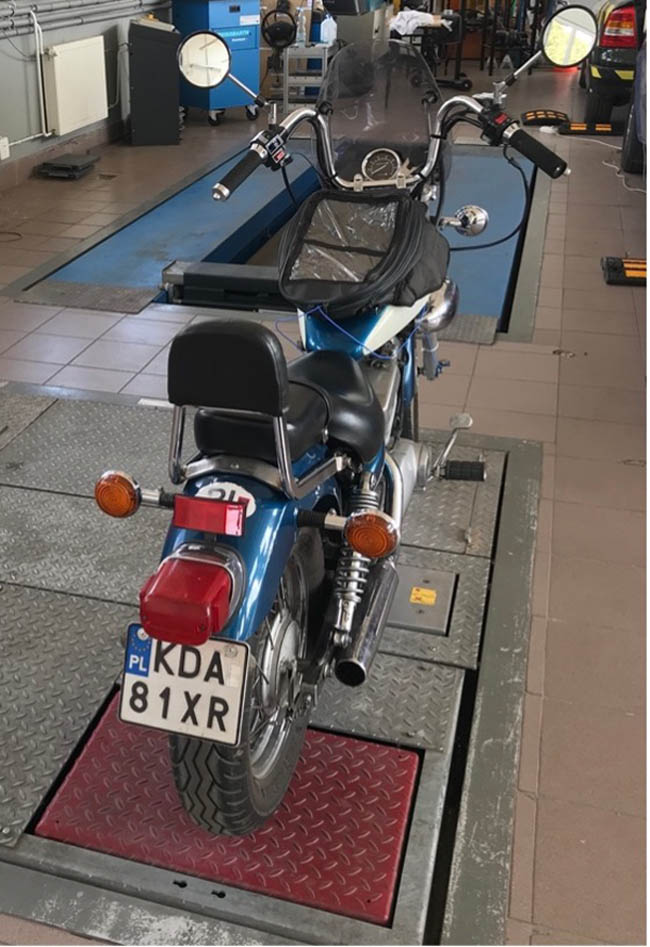 Figure 4 
               The motorcycle before the suspension test on the Bosch Beissbarth diagnostic line.
            