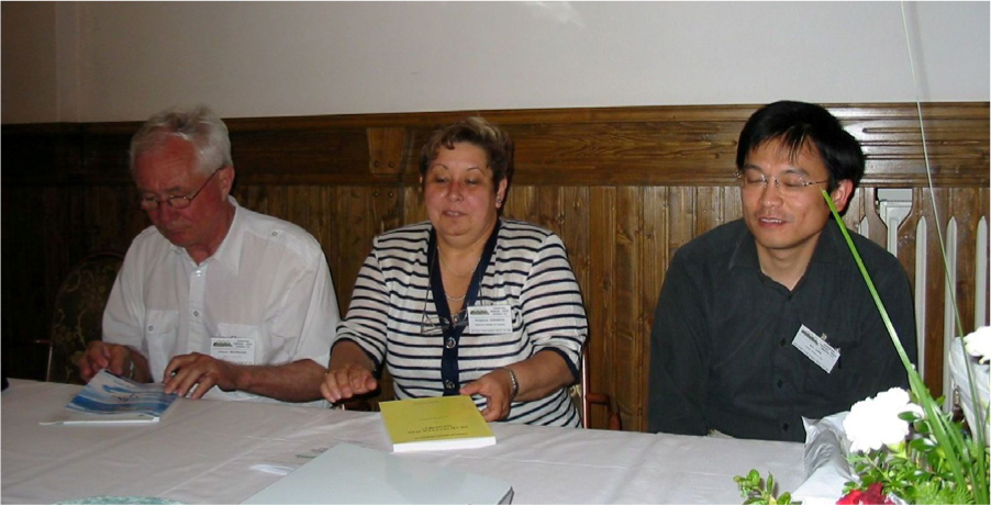  A rare photo taken by Igor Podlubny at the ICCC ’2003 conference. Prof. Virginia Kiryakova with Prof. Svante Westerlund (left) and Prof. Wen Chen (right)