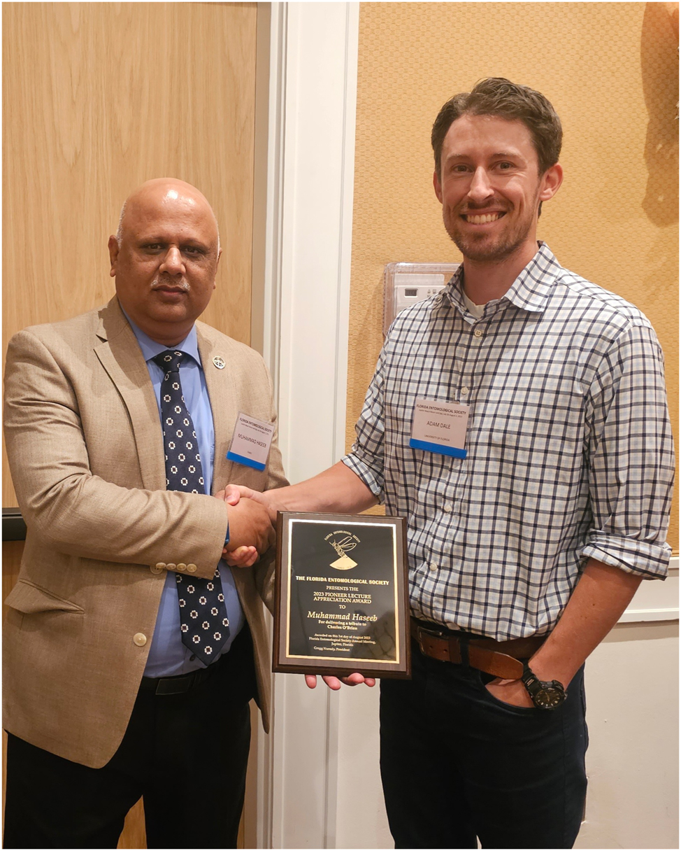Figure 7: 
Dr. Adam Dale, Chair of the FES Pioneer Lecture Committee, presenting the Pioneer Lecturer Award to Dr. Muhammad Haseeb (2023).
