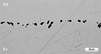 Figure 1: The experimental results of Frenkel effect (voids formation) during diffusion between pure Fe and Pd after 150 h at 1,273 K.