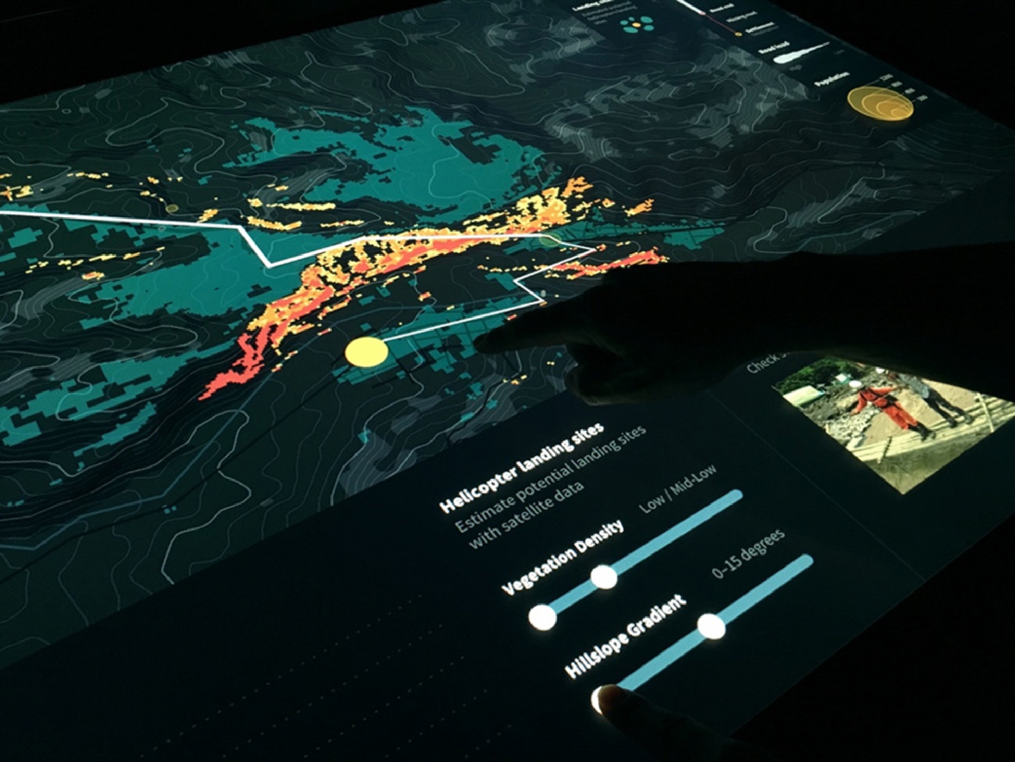 Figure 12 
              User configuring vegetation density and hillslope gradient values with the interface for estimating potential landing sites around a settlement.
            