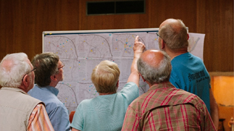 Figure 9 
            Participants discussing their maps during a workshop.
          