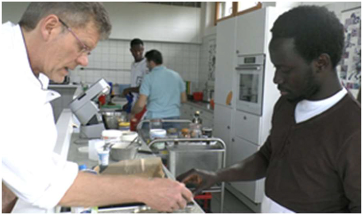 Figure 6: 
Instructor takes cookie cutter from apprentice (and lays it down).
