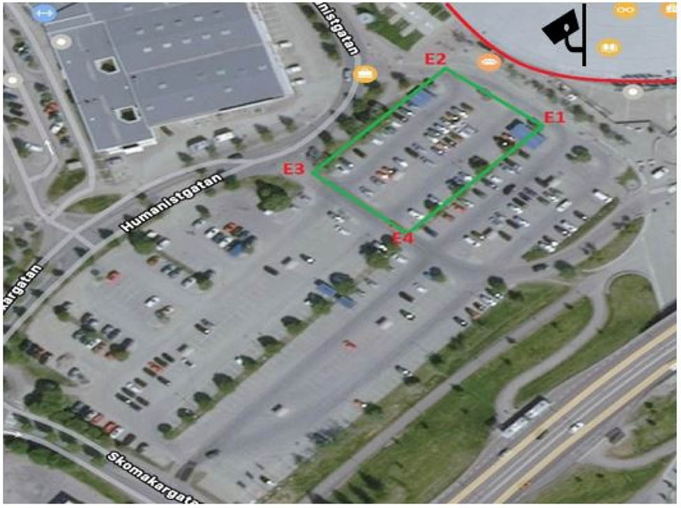 Figure 1 
                  Observed parking lot and the region of interest highlighted by the green line.
               