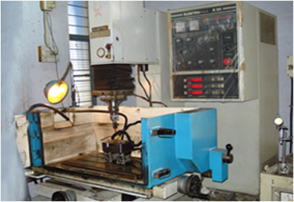 Figure 2 
               Experimental setup on a Toolcraft V40506 microEDM machine.
            