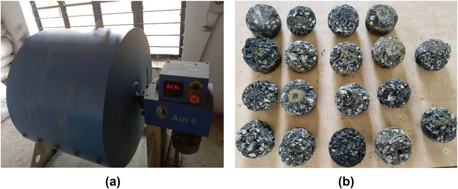 Figure 9 
                  (a) Los Angeles abrasion test machine and (b) samples after testing.
               