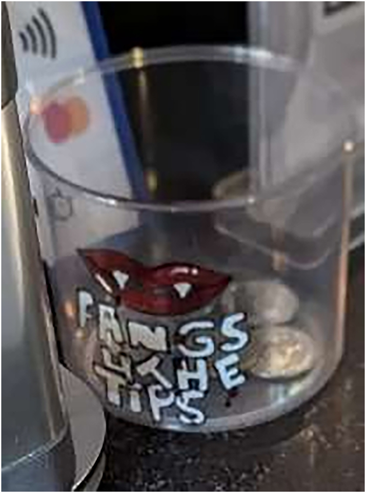 Figure 6: 
A message written on a tip box in English ‘Fangs 4 the tips’.
