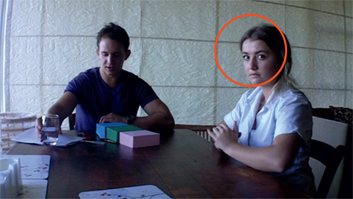 Figure 6: Eleanor producing the higher-level action of participating in research as she glances at the camera.