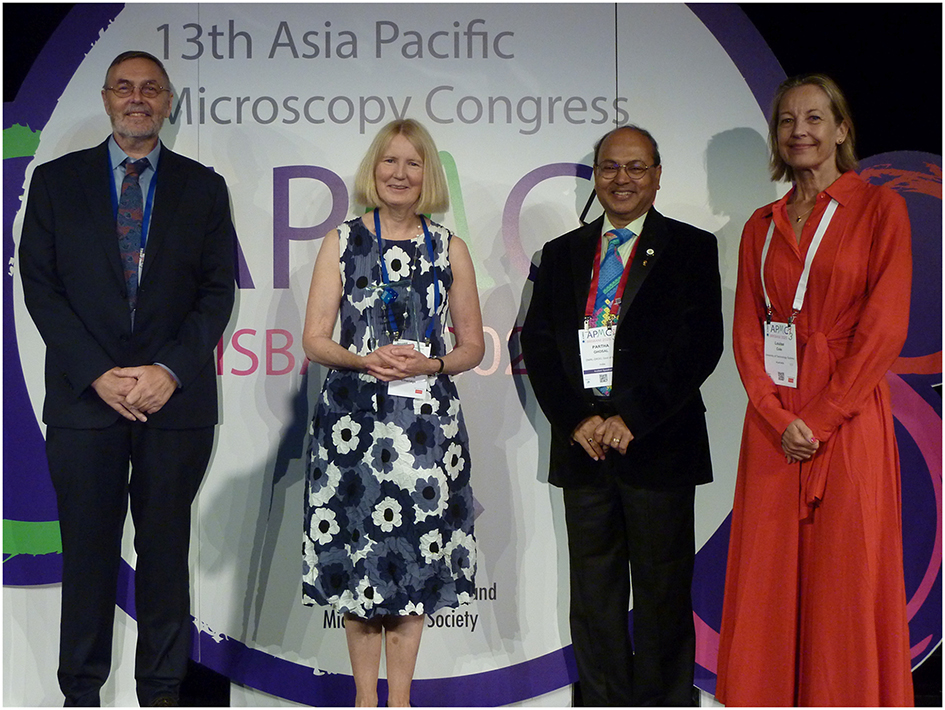  
APMC13 began each morning with a keynote. The first on “101 things to do with an energetic electron” was presented by Joanne Etheridge (2nd from left) and introduced by Partha Ghosal (3rd from left, APMC12 chair). They were joined on stage by APMC13 chairs Roger Wepf (left) and Louise Cole (right) (Photo: Martin Friedrich).
