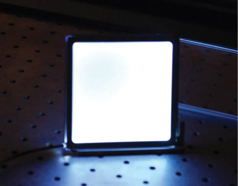 Figure 13 4″x4″ glass plate with scattering top layer with LDF coupled to the side of the plate. The 445 nm diode is 1 W, brightness of the plate ~1000 nits.