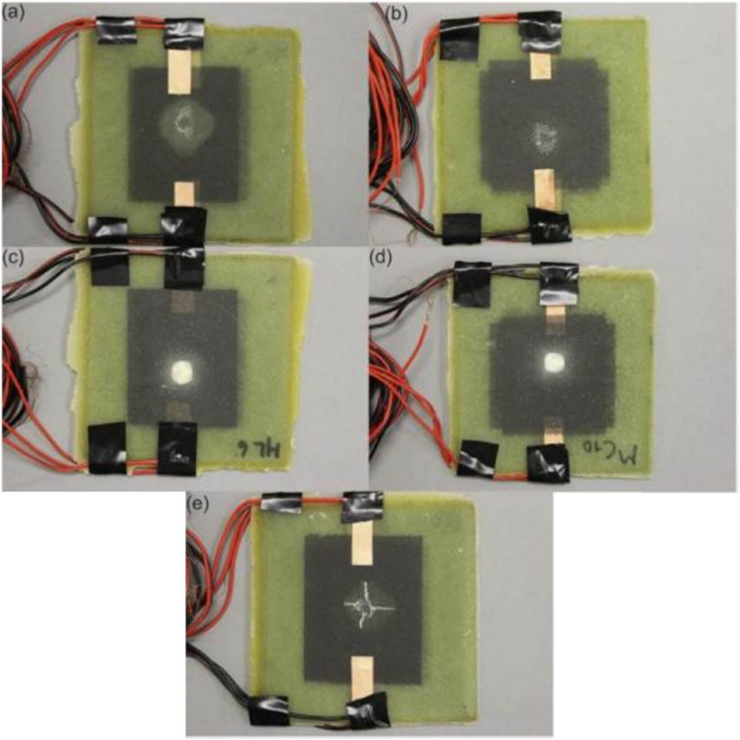 Figure 26 
               The visible impact damage after seven impact loads (each impact energy is 10.150 J) in the test: the impact surface and the back surface of (a and c) the sample loaded with parallel CNT films composite material and (b and d) the sample loaded with cross-laminated CNT films; and (e) impact surface of the second composite specimen loaded with parallel CNT films [159].
            