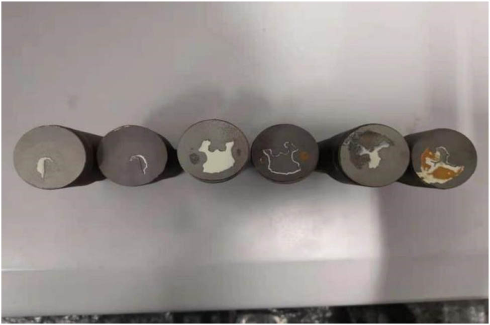 Figure 3 
                  Macro-morphology of the coatings in bonding strength test.
               