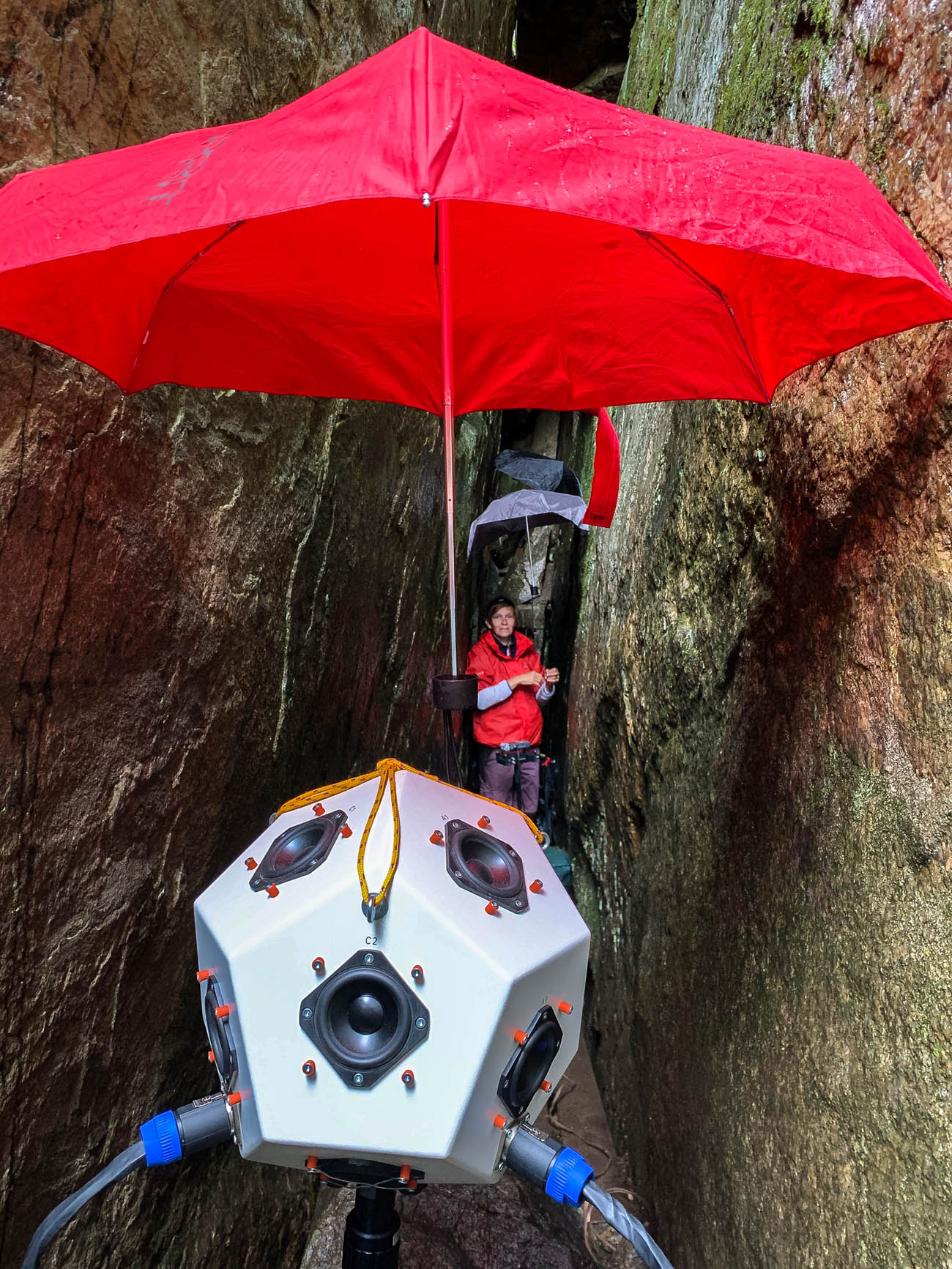 Figure 4
Preparing for acoustic measurements in the inner corridor of the Pirunkirkko cave on 23rd of July 2020. The dodecahedron loudspeaker in the foreground, researcher Rainio at the back. Photo: Julia Shpinitskaya.
