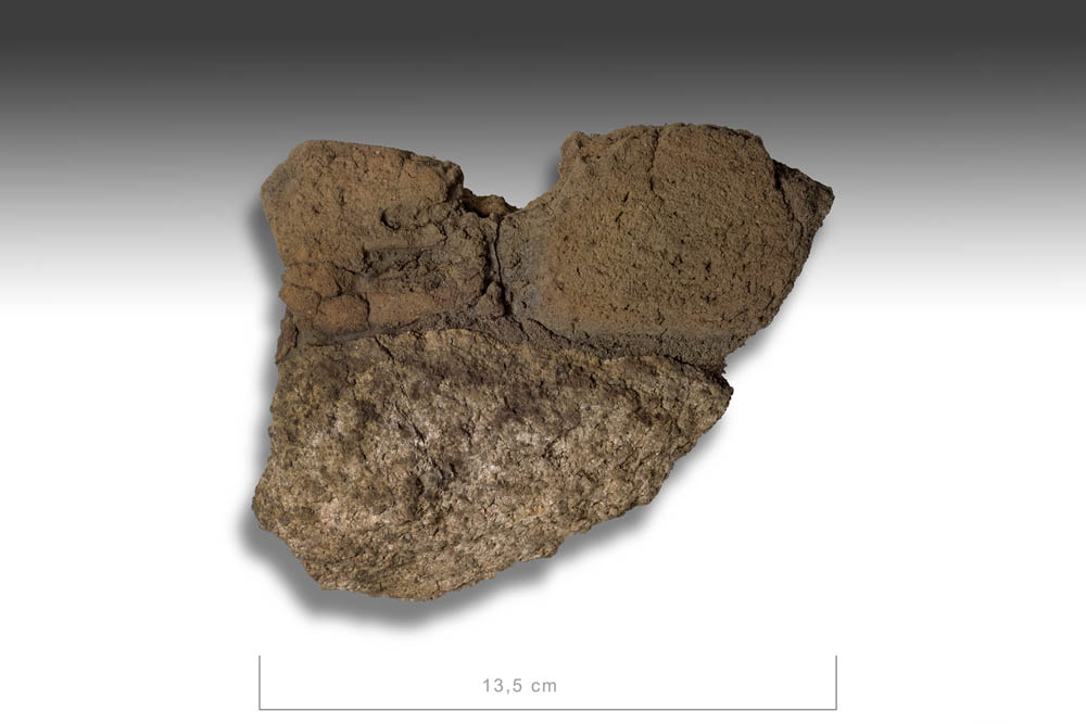 Figure 3
A wall fragment from one of the furnaces at the Vivungi site, comprising a section of the original clay shaft (with an air inlet hole), and parts of the stone frame (photograph by Staffan Nygren © Norrbottens museum).