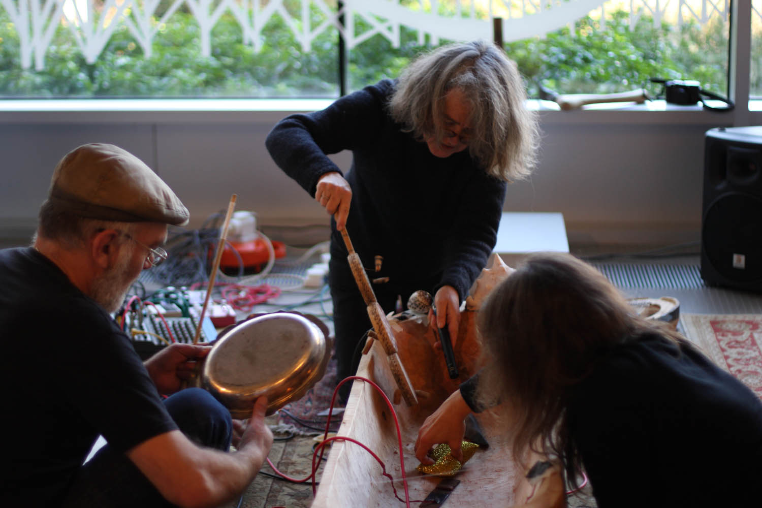 Figure 3 
                  Sound artists Mirco Gargioni, Katie O’Looney, and Angelika Höger playing the Pallasboy vessel in Cork Public Museum (Credit: Brian Mac Domhnaill, PP).
               