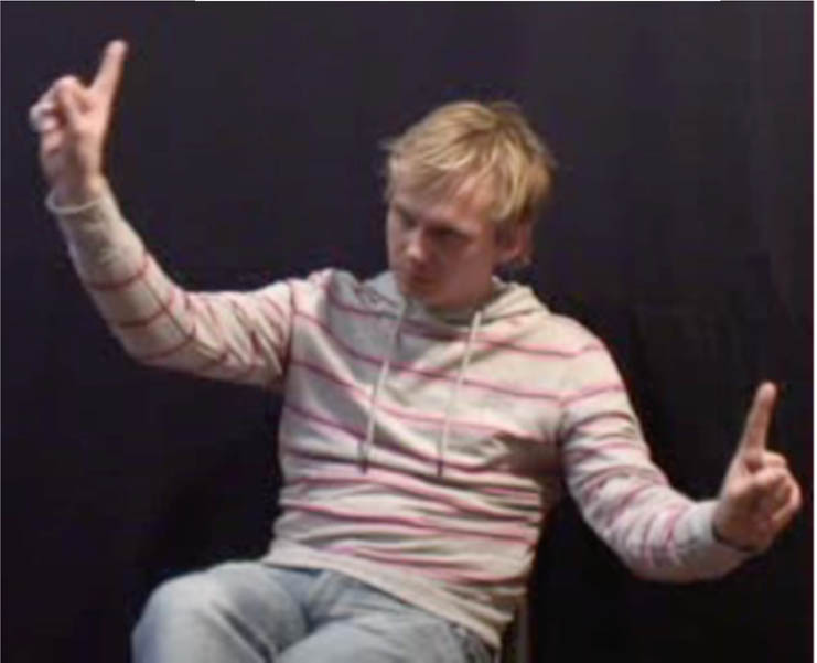 Figure 8 
                  Example of the use of two instances of the 1-handshape on the two hands, expressing contrastive localization of two referents. Source: Corpus NGT (NB does not come from the data set analyzed for the current study).
               