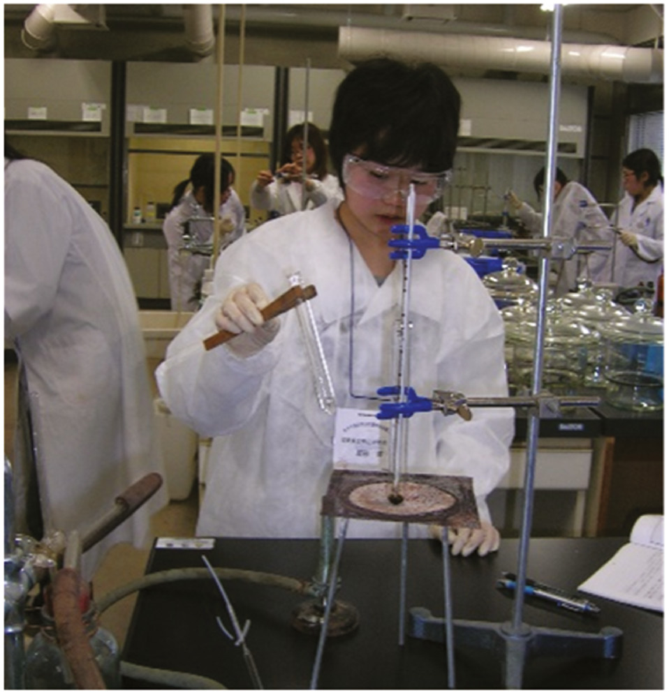 Fig. 4: Female high school students enjoying experiments as part of Kansai Kagakujuku (2009).