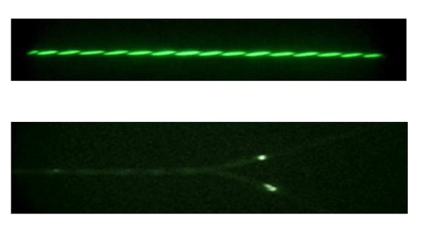 Figure 4 Pictures of twisted pairs in darkness taken by a night vision device at identical voltages (upper picture: standard wire; lower one: modified pair).
