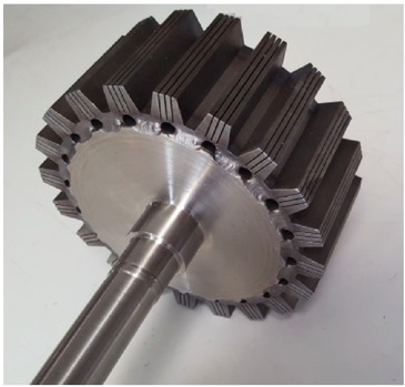 Figure 2 Massive iron rotor with longitudinal slits for limiting eddy currents.