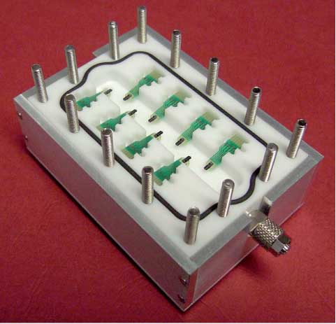 Figure 9 Teflon measurement cell holding eight MC chips applicable for either gas single injection or gas flow mode. Reproduced with permission from Filenko et al. (2008).