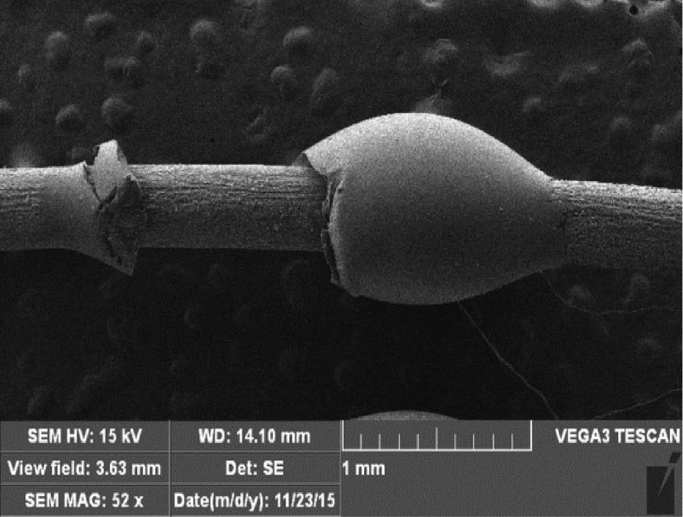 Figure 11: Micrograph of debonded epoxy microdroplet on a treated fiber surface.