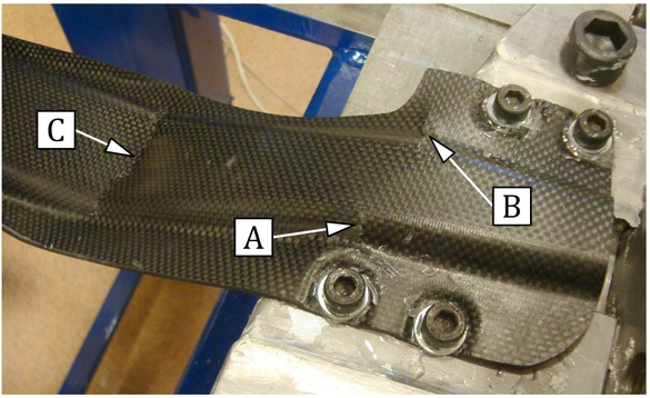Figure 9 A fragment of the beam destroyed during the test with marked crack sites.