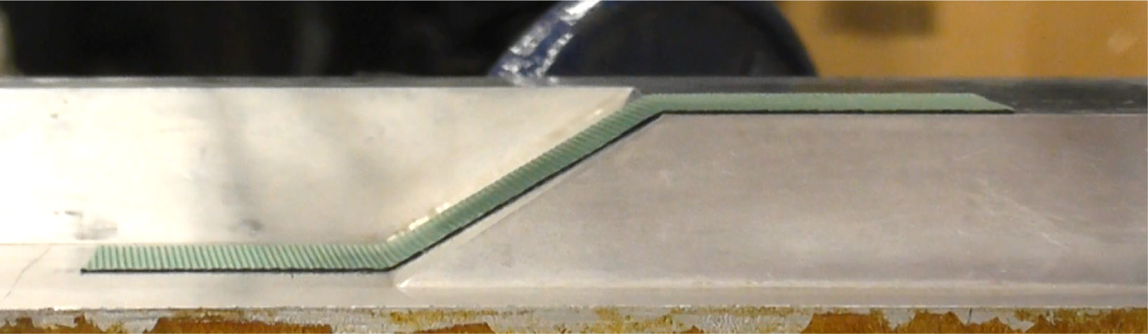 Figure 6 Image of a ply successfully laid onto a curved mould shape by the TacTip.