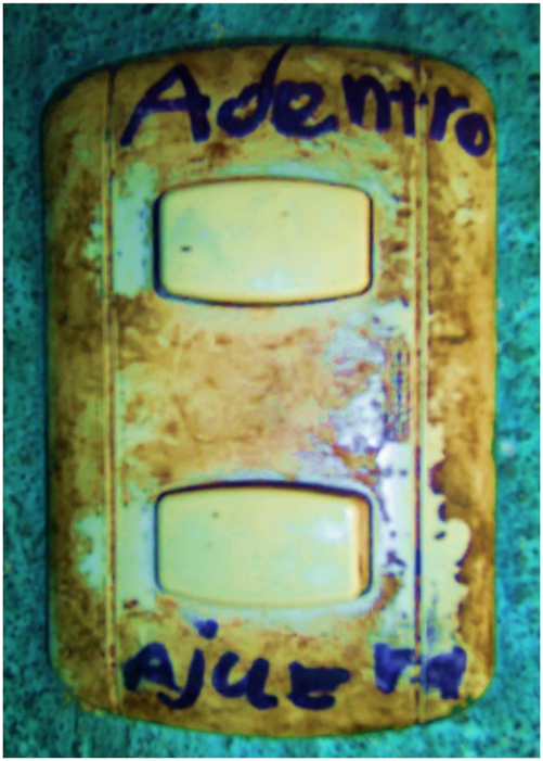 Figure 1: 
A light switch in the K’iche’-speaking municipality of Nahualá, Guatemala. The switches are labeled as adentro ‘inside’ and ajuera ‘outside’, with the grapheme j taking the place of f in ‘outside’, denoting lenition (Photo by the first author).
