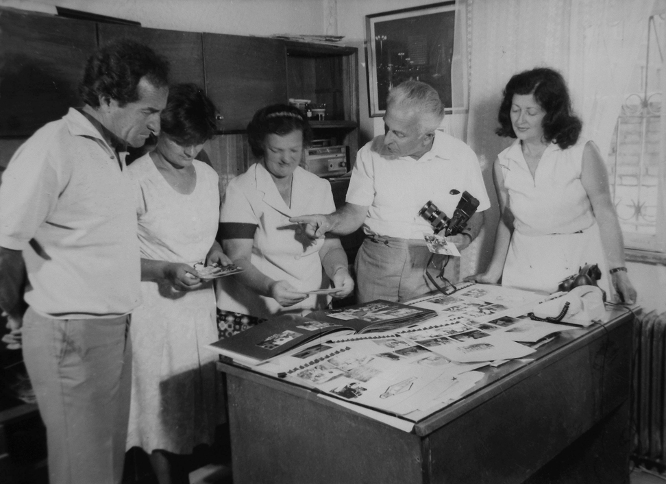 Figure 2: 
The head of the ATSH photo lab, Petrit Kumi, with his collaborators. Tirana, late 1980s. Courtesy: private collection, Tirana. This image is an example of a common practice from the 1960s onwards: the self-staging of photographers’ work for self-promotion.