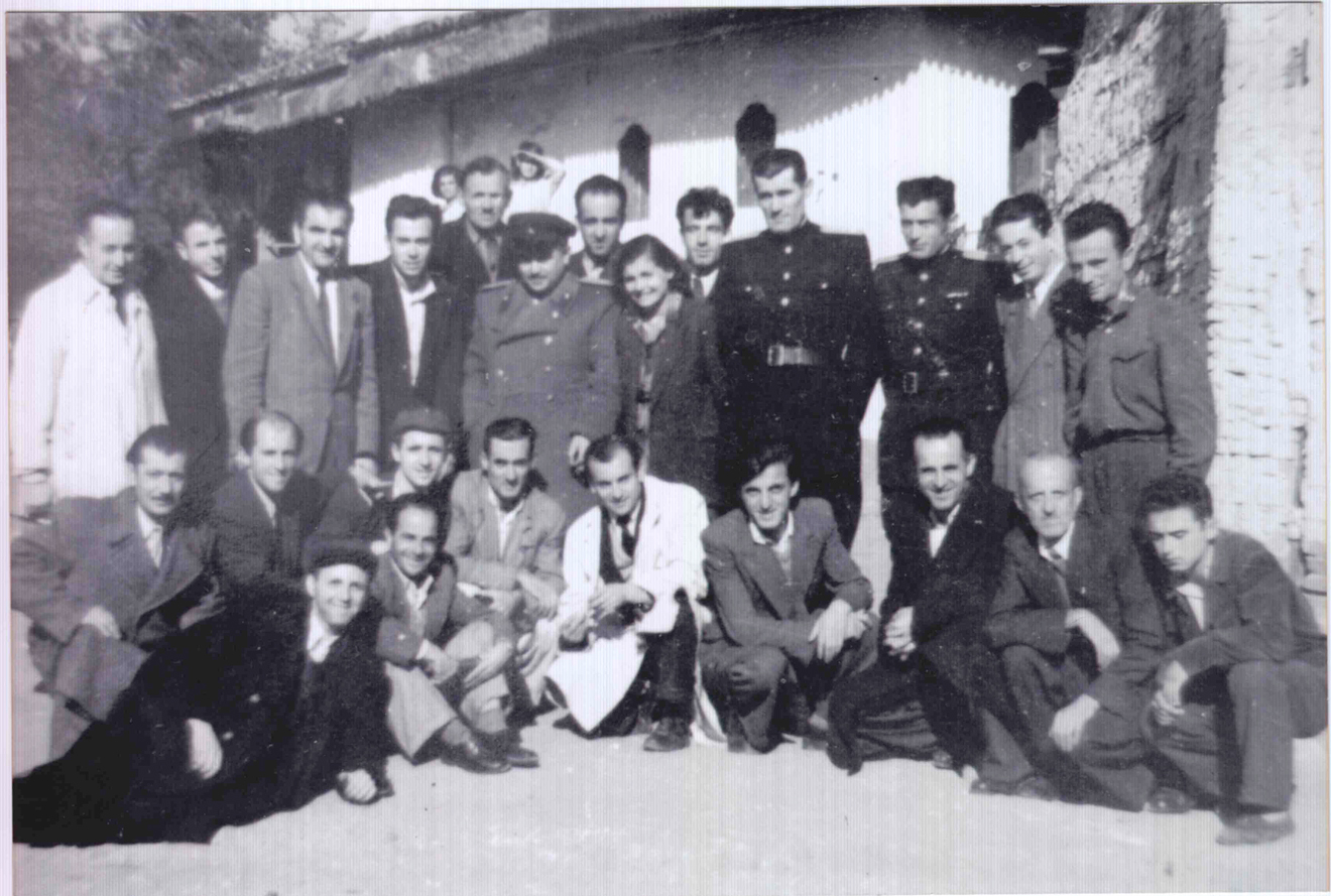 Figure 7: 
Photographers and employees of the Tirana craftsmen’s cooperative, 1954. Courtesy: Private collection, Tirana. The cooperative gathered tailors, shoemakers, hairdressers, launderers and photographers. This picture was taken on the occasion of a course given by the head of the photo studio, Vasil Ristani (standing, third from left) at the premises of Sami Frashëri school, Tirana.