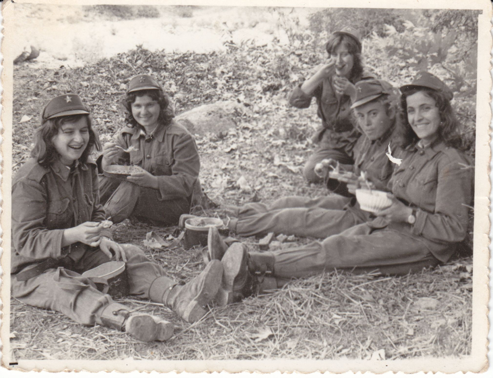 Figure 12: 
Young women during military training, early 1970s. Courtesy: Private collection, Bilisht. The spectacle of young women in military dress was the subject of numerous photographic representations, for private use as here, but also in the press. The same motif serves both a memorial function at the individual level and an ideological function at the level of the official discourse on the dedication of the entire population to the defence of the fatherland, as well as on female emancipation.