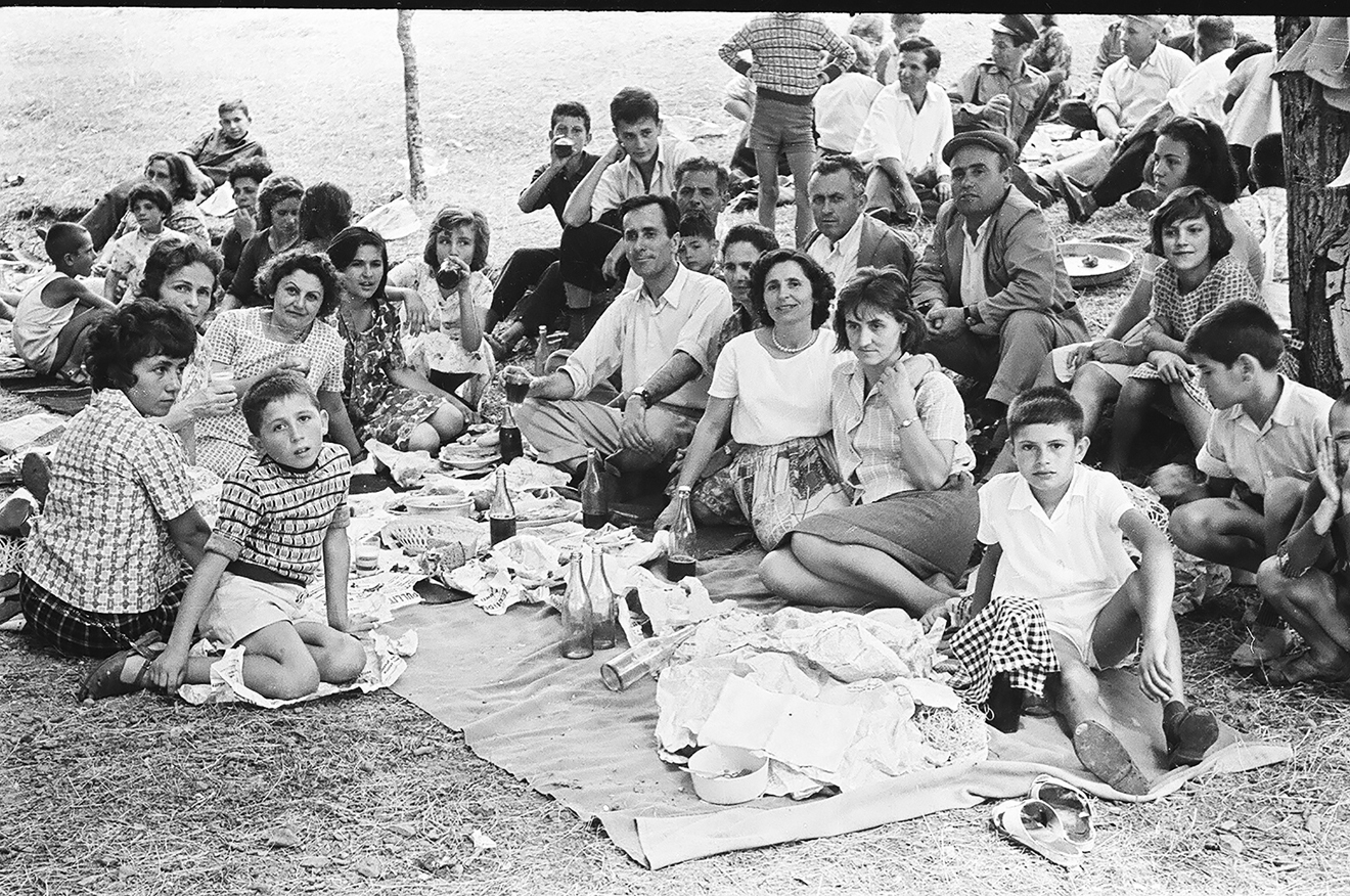 Figure 13: 
Family picnic on May Day, Korçë, 1970s. Courtesy: Private collection, Korçë. Many of the photographic representations of the family imply a wider social framework in which both conformity and, as here, a certain hierarchy are staged: the attitude of the guests, their clothing and accessories (watches, jewellery) are indicative of their membership of the local political elite.