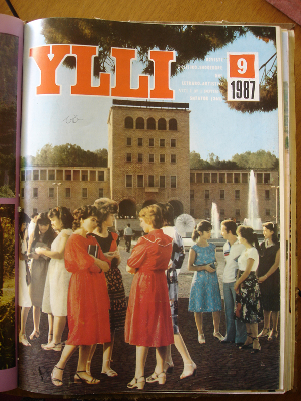 Figure 18: 
Cover from Ylli, September 1987. Courtesy: Gilles de Rapper, 2012. Copies of the magazine were bound in annual volumes and placed in public libraries. The magazine, monthly and richly illustrated, was distributed nationwide and was available on subscription. The September 1987 cover theme is the start of the new academic year and features a rare example of photo-montage by collage.